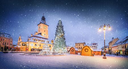 Christmas market and decorations tree in center of Brasov town, Transylvania, Romaniaの写真素材