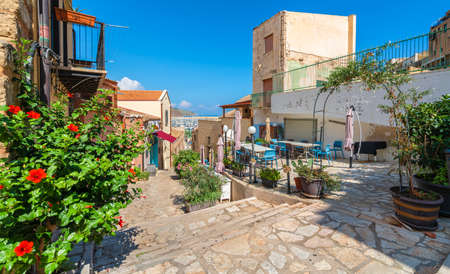 Historic village of Castellammare del Golfo with terrace, bar and restaurant in Sicily, Italyのeditorial素材