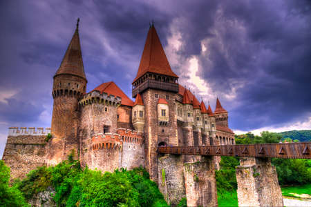 Hunyad Corvin castle iwith storm  clouds in Hunedoara,Transylvania,Romania,Europeのeditorial素材