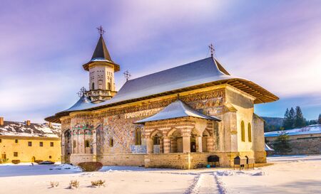 Sucevita orthodox painted church monastery in winter season, Suceava town, Moldavia, Bucovina, Romaniaの写真素材