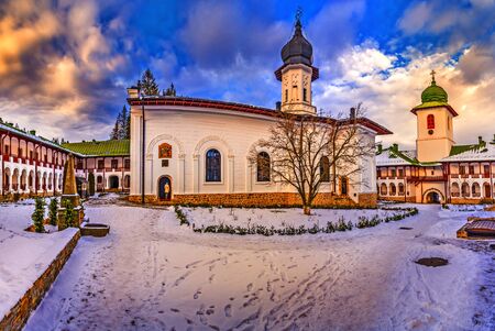 Agapia orthodox church monastery in winter season, Agapia town, Moldavia, Romaniaの写真素材