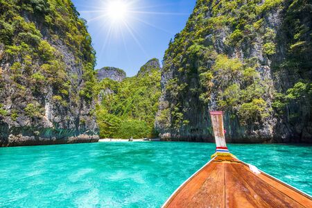 Landscape with  longtail boat on Loh Samah Bay, Phi Phi island, Thailandの写真素材