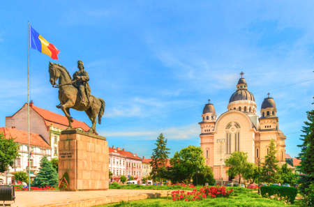 Avram Iancu statue and ortodox church in the Roses Square, Targu Mures, Transylvania, Romania.のeditorial素材