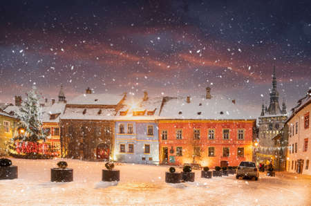 Christmas market and decorations tree in the main center of  Sighisoara town at winter season, Romaniaの写真素材