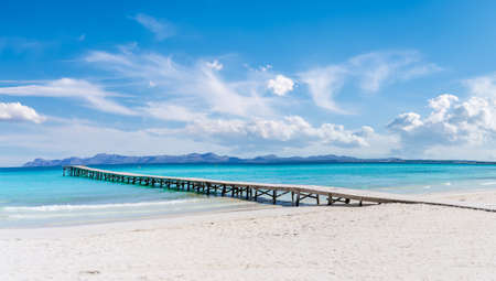 Landscape with boardwalk at the coastline of Platja de Muro in Alcudia bay, Majorca Island, Spainの写真素材
