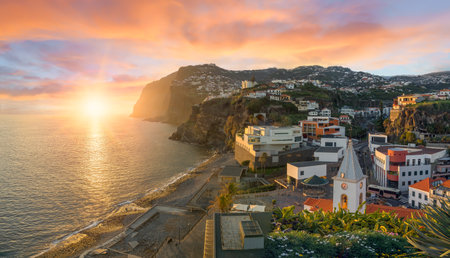 Camara de Lobos village at sunset, Cabo Girao in background, Madeira island, Portugalの写真素材