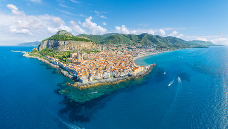 Aerial view showcasing its historic architecture, stunning coastline, and Mediterranean charm of Cefalu, Sicily.の写真素材