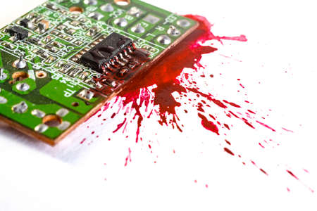 circuit board explosion, with red paint, blood explosion of an electronic component. Selective focus...