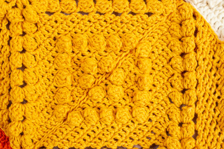 crochet pattern with bubble stich yellow colored thread
