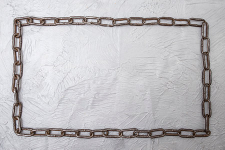Continuous chain frame flat lay on gray cement background, template design