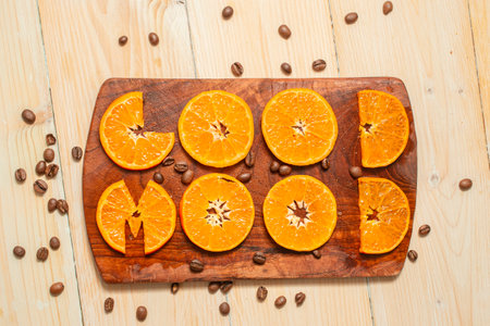 good mood written with mandarin orange slices, on a wooden chopping boardの写真素材