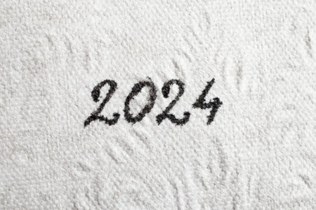 2024 number written with black ink on white tissue paper, Close up texture