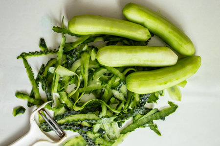 peeled cucumber on white background, abstract backdropの写真素材