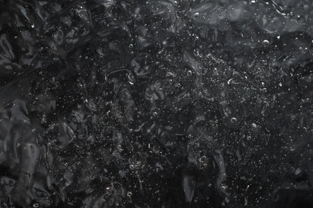 gel structure on black  background, backdrop for cosmetic products, soft focusの写真素材