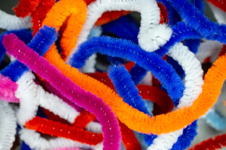 Colorful fluffy wires knot abstract texture background, soft focus close up