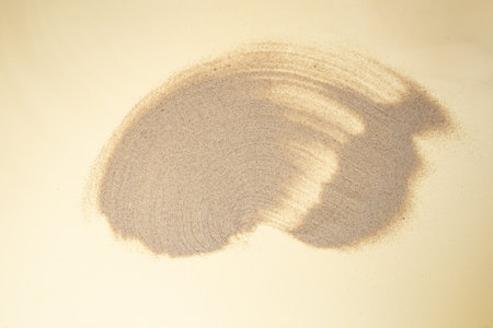 Desert sand pile sweep, dune backdrop on cream background abstract soft focus close up