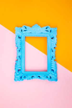 Blue classic frame on dual tone paper background, orange and pinkの写真素材