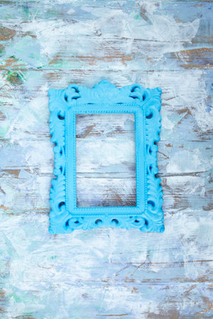 Blue painted baroque frame on painted wooden boards wall stucco , abstract textures wallpaper, art gallery  backdropの写真素材