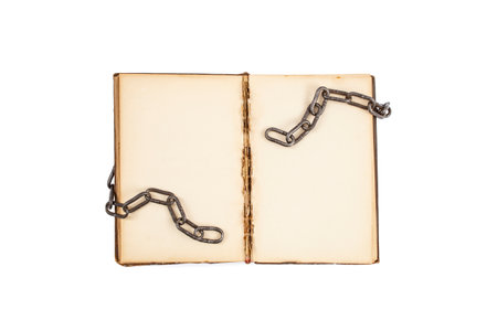 Open book with empty yellowed pages and broken chains isolated on white  background, freedom of speech in literatureの写真素材