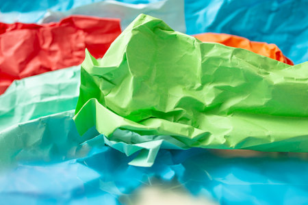 Multiple colors crumpled paper pages, abstract texture, close upの写真素材