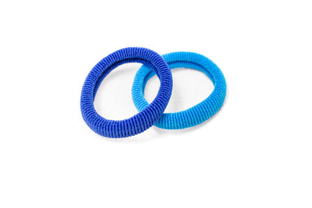 Two blue colored rubber bands for long hair isolated on whiteの写真素材