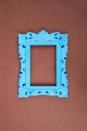 Blue painted baroque frame on brown paper background,の写真素材
