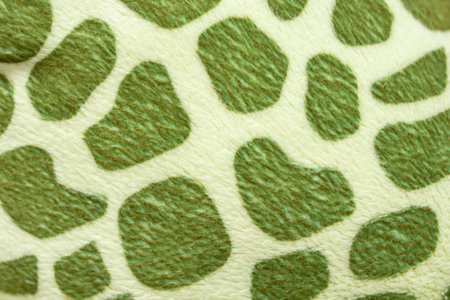 Green animal skin pattern on synthetic fiber fabric, soft felt toy manufacturing, abstractの写真素材