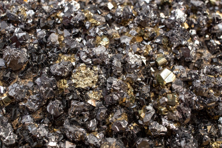 Pyrite mineral flower black and golden color soft focus close up, abstract pattern