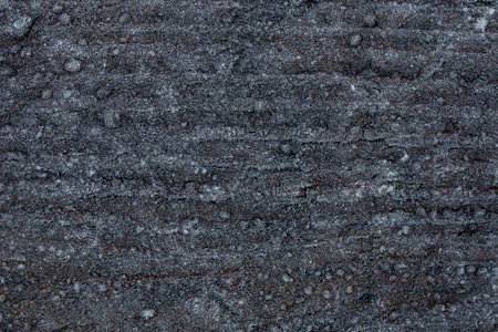 Frozen fog, ice particles on black wood background, abstract texture