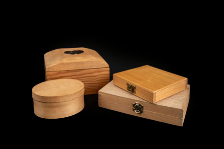 Wooden boxes with closed lid scattered and isolated on black  background, abstract   conceptの写真素材