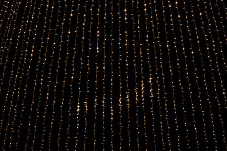 Christmas decorations lights garlands covering the night sky, minimal   backdrop