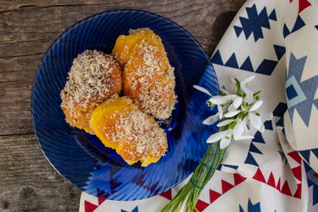 Romanian mucenici from Moldova region: figure eight shaped sweet bread, sprinkled with honey and crushed nuts. Traditional dessert for the Christian feast of the 40 Martyrs of Sebasteの写真素材