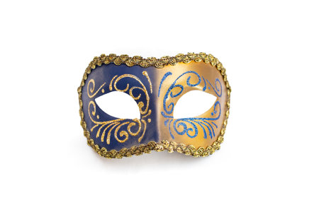 Blue colored carnival mask with golden glitter decorations, isolated on whiteの写真素材