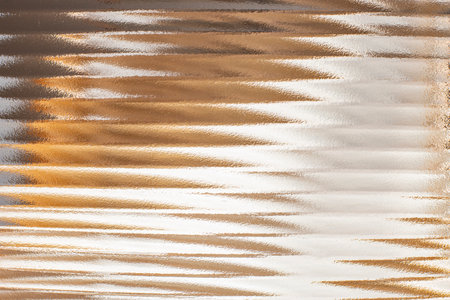 Wavy corrugated glass, beige or golden color backdrop,  abstract wallpaper