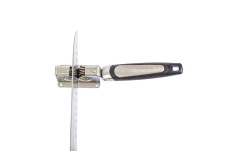 Vintage knife sharpener with a santoku chef knife, top view isolated on whiteの写真素材