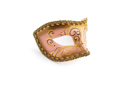 Pink colored carnival mask with golden glitter decorations, close up isolatedの写真素材