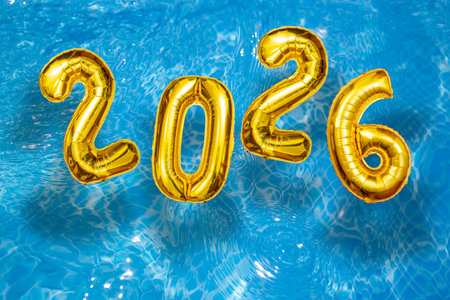 2026 Inflatable golden numbers on water ripples surface, happy new year with a swimming pool party