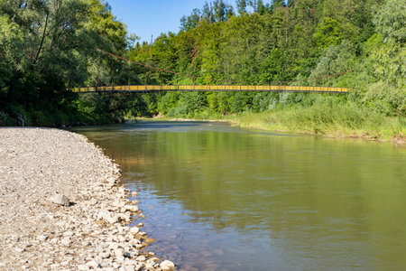 Bridge over a river in the forest connecting mountains, side viewの写真素材