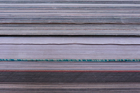 Books stack texture close up, abstract