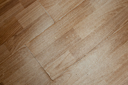 Worn laminate parquet surface with wooden pattern, abstract  backdrop