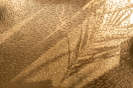 Empty golden jigsaw puzzle with sun rays and palm leaf shadows, abstract cosmetic backdrop