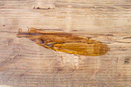 Varnish smear on oak hard wood texture, abstract close upの写真素材