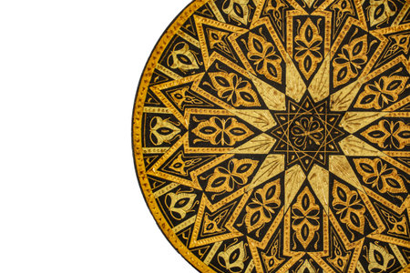 Carved bronze plate embroidery close up detail on white