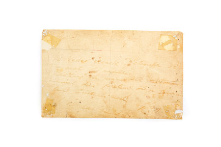 Backside of an old photo with stains, weathered pattern and faded crayon writing.の写真素材