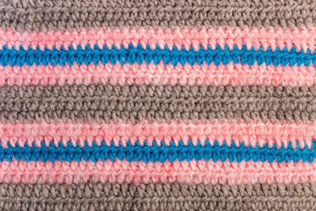 Horizontal blue pink and brown crochet lines pattern, abstract  background