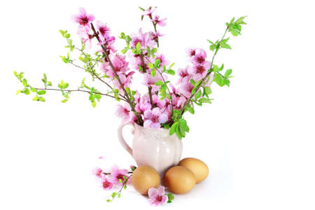 Easter egg with candle on white background