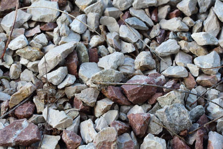 colored small stones and branches for the design background