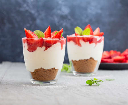 Strawberry cheesecakes in a glass on the table