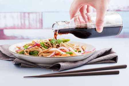 traditional Japanese noodles with vegetables in a plate on the table
