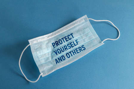 blue face mask on a blue backgroundの写真素材